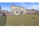 Spacious backyard with home, grass, and raised garden beds at 488 Sanctuary Park Dr, Summerville, SC 29486