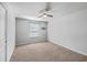 Spacious bedroom with carpeted floor, ceiling fan, and large window at 488 Sanctuary Park Dr, Summerville, SC 29486