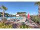 Relaxing community pool with patio furniture and picnic tables at 488 Sanctuary Park Dr, Summerville, SC 29486