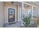 Modern front door with glass panels and a welcoming porch at 488 Sanctuary Park Dr, Summerville, SC 29486