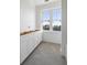 Bright bathroom with white cabinets and hexagonal tile floor at 619 Carolina Blvd, Isle of Palms,  29451