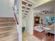 View of a carpeted staircase leading to an open living area with hardwood floors and fireplace at 941 Law Ln, Mount Pleasant,  29464