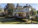 Two story home with wrap around porch and manicured lawn at 103 Sw Railroad Ave, Saint George, SC 29477