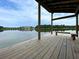 Serene wooden dock with bench overlooking the lake at 105 Archdale St, Summerville, SC 29486