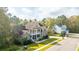 Two-story brick home with front porch, balcony, and landscaped yard in a quiet neighborhood at 1068 Blockade Runner Pkwy, Summerville, SC 29485