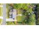 Aerial view of house with solar panels, backyard patio, and wooded surroundings at 1068 Blockade Runner Pkwy, Summerville, SC 29485