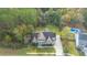 Aerial view of a two-story house with stone exterior, and a large backyard at 1068 Blockade Runner Pkwy, Summerville, SC 29485