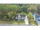 Aerial view of a two-story house with stone exterior, and a large backyard at 1068 Blockade Runner Pkwy, Summerville, SC 29485