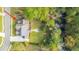 Aerial view of house with solar panels, backyard patio, and wooded surroundings at 1068 Blockade Runner Pkwy, Summerville, SC 29485