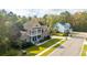 Two-story brick home with front porch, balcony, and landscaped yard in a quiet neighborhood at 1068 Blockade Runner Pkwy, Summerville, SC 29485