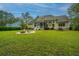 Large backyard with fire pit and spacious lawn at 1068 Blockade Runner Pkwy, Summerville, SC 29485