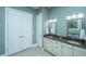 Bathroom with double vanity, granite countertops, and a large mirror at 1068 Blockade Runner Pkwy, Summerville, SC 29485