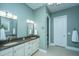 Elegant bathroom with double vanity, granite countertops, and a large soaking tub at 1068 Blockade Runner Pkwy, Summerville, SC 29485