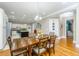 Dining room with hardwood floors and a large wooden table at 1068 Blockade Runner Pkwy, Summerville, SC 29485