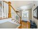 Bright entryway with hardwood floors and wooden staircase at 1068 Blockade Runner Pkwy, Summerville, SC 29485