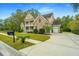 Brick home with a two-car garage and nicely landscaped lawn at 1068 Blockade Runner Pkwy, Summerville, SC 29485