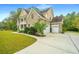 Brick home with a two-car garage and large driveway at 1068 Blockade Runner Pkwy, Summerville, SC 29485