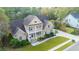 Brick two-story home with a wrap-around porch and landscaped yard at 1068 Blockade Runner Pkwy, Summerville, SC 29485