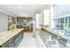 Kitchen features double sinks, granite countertops, and white cabinets at 1068 Blockade Runner Pkwy, Summerville, SC 29485