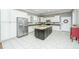 Modern kitchen with white cabinets, granite counters, and island at 1068 Blockade Runner Pkwy, Summerville, SC 29485
