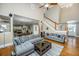 Large living room with hardwood floors, sectional sofa, and fireplace at 1068 Blockade Runner Pkwy, Summerville, SC 29485