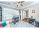 Home office with built-in shelving, hardwood floors, and large window at 1068 Blockade Runner Pkwy, Summerville, SC 29485