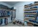 Spacious walk-in closet with built-in shelves and hanging rods at 1068 Blockade Runner Pkwy, Summerville, SC 29485