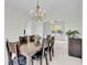 Bright dining room with chandelier and seating for six at 1106 Mccrea Dr, Moncks Corner, SC 29461