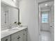 Bright bathroom with a single vanity and access to a hallway at 1115 Saltwater Cir, Johns Island,  29455