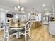 Open concept dining area with kitchen and living room views at 1115 Saltwater Cir, Johns Island,  29455