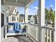 Relaxing front porch with blue couch and view of the neighborhood at 1115 Saltwater Cir, Johns Island,  29455