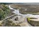 Aerial view of a tranquil marsh with wooden dock at 1115 Saltwater Cir, Johns Island,  29455