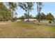 Spacious yard with flag and paved walkway leading to the house at 113 Hill Drive, Summerville, SC 29483