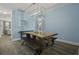 Stylish dining room with a live-edge wood table, benches, and a modern chandelier at 1187 Landau Ln, Mount Pleasant,  29466