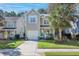 Two story home with teal door, solar panels and palm trees at 1187 Landau Ln, Mount Pleasant,  29466