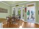 Charming dining area with bay window and sunroom access at 1272 Waterfront Dr, Mount Pleasant, SC 29464