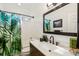 Modern bathroom with quartz countertop and black fixtures at 128 Beresford Creek St, Charleston, SC 29492