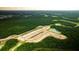 Aerial view of new home community with lots and ponds at 136 Lilac Grove Way, Summerville, SC 29486