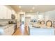 Modern kitchen with white cabinets, granite countertops, and stainless steel appliances at 138 Lilac Grove Way, Summerville, SC 29486