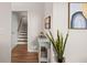 A light-filled hallway with stairs and tasteful decor at 1412 White Ibis Ct, Hanahan, SC 29410