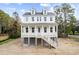 Two-story home with white siding, gray roof, and a front porch at 1577 Periwinkle Dr, Mount Pleasant, SC 29466