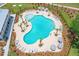 Community pool with lounge chairs and umbrellas at 1623 Cultivation Lane St # 446, Mount Pleasant, SC 29466