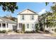 Charming light beige two-story home with green shutters and a welcoming front porch at 1628 Ware Bottom Ln, Mount Pleasant, SC 29464