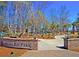 Carolina Bay Park entrance with a brick sign and walking path at 1850 Grovehurst Dr, Charleston,  29414