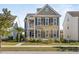 Two-story house with taupe siding, black shutters, and a front porch at 1850 Grovehurst Dr, Charleston,  29414