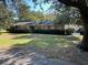 Ranch-style home with spacious lawn and mature trees at 1853 N Piper Dr, Charleston, SC 29407