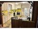 Retro kitchen features yellow countertops and white cabinets at 1853 N Piper Dr, Charleston, SC 29407