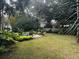 Inviting pool area with lounge chairs and tropical plants at 19 23Rd Ave, Isle of Palms,  29451