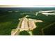 Aerial view of new home community development surrounded by lush green trees and ponds at 215 Terrace View Dr, Summerville, SC 29486