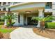 Elegant building entrance with columns and lush landscaping at 221 S Plaza Ct # 107, Mount Pleasant, SC 29464